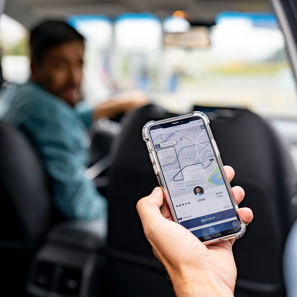 Man getting into a car he requested using a mobile app