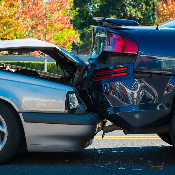 Car accident scene with two damaged vehicles in Southern California.